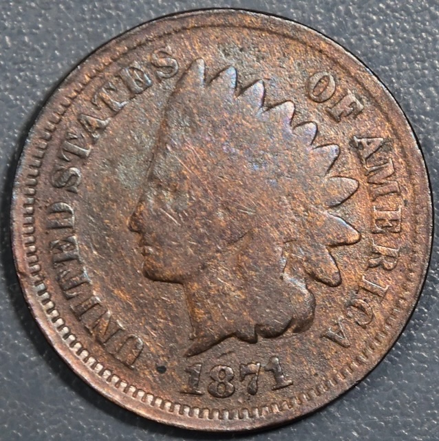 1871 Indian Head Penny CUD-001 die break showing raised cud blob at the rim area caused by a die chip